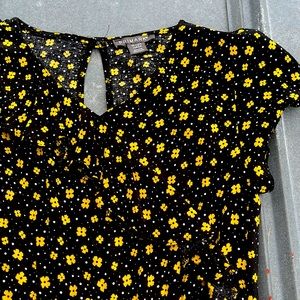 Never worn black and yellow romper. Youth 10-12